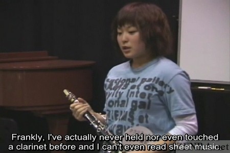 Miki Hayakawa admits she has no musical experience while holding a clarinet